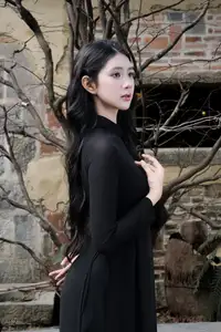 Timeless Beauty: Graceful Vietnamese Lady in Black Ao Dai Captivates with Asian Elegance.-2