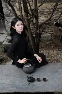 Timeless Beauty: Graceful Vietnamese Lady in Black Ao Dai Captivates with Asian Elegance.-5