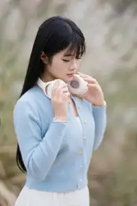 Explore Serene Beauty: Long-Haired Girl Immersed in Music Amidst Pampas Grass-5