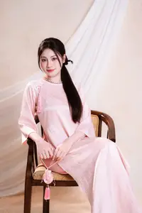 Vietnamese Beauty: Graceful in Traditional Pink Ao Dai and Conical Hat-2
