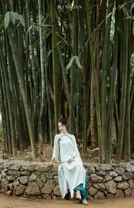 Vietnamese Grace: Elegant Portrait of a Young Woman in Lush Nature-17