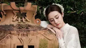 Gentle Elegance: Vietnamese Girl in Pure White Ao Dai with Hair Flowers - Traditional Beauty.-9