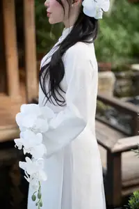 Elegant White Ao Dai: Pure Beauty of Vietnamese Woman with Pristine Orchids.-0