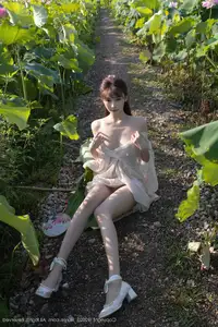 Discover Lu Xuan Xuan's Graceful Beauty in a White Dress Amidst a Serene Lotus Pond - XiuRen No.10630-47