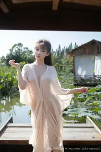 Discover Lu Xuan Xuan's Graceful Beauty in a White Dress Amidst a Serene Lotus Pond - XiuRen No.10630-39