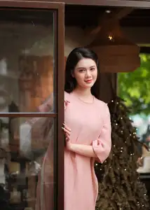 Discover Serene Vietnamese Beauty: Elegant Woman in Pink Linen Dress Amidst Floral Charm-6