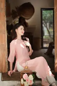 Discover Serene Vietnamese Beauty: Elegant Woman in Pink Linen Dress Amidst Floral Charm-3