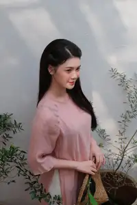 Discover Serene Vietnamese Beauty: Elegant Woman in Pink Linen Dress Amidst Floral Charm-2