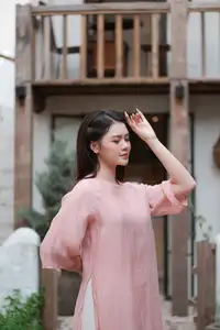 Discover Serene Vietnamese Beauty: Elegant Woman in Pink Linen Dress Amidst Floral Charm-5