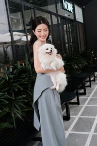 Elegant Woman and Adorable Pomeranian: Chic Fashion & Pet Joy.-4