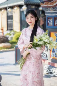 Graceful Asian Lady in Pink Ao Dai with Pristine White Lilies in Traditional Setting-0