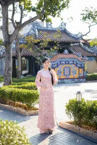 Graceful Asian Lady in Pink Ao Dai with Pristine White Lilies in Traditional Setting-9