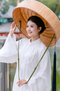 Graceful Vietnamese Beauty: A Serene Woman in White with a Lily-3