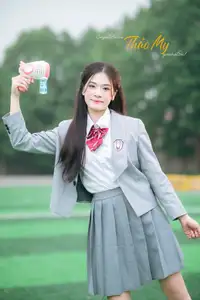 Cute Schoolgirl Frames a Moment on Green Grass-8