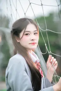 Cute Schoolgirl Frames a Moment on Green Grass-6