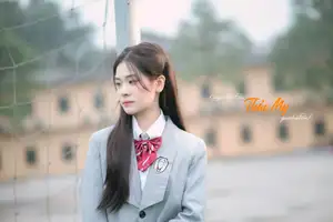 Cute Schoolgirl Frames a Moment on Green Grass-10