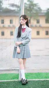 Cute Schoolgirl Frames a Moment on Green Grass-7