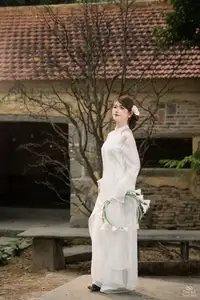 Elegant Asian Beauty: A Gentle Girl Adorned with a Pure White Orchid-14