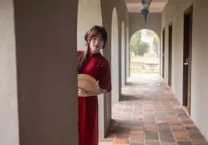 Discover the Timeless Elegance of a Vietnamese Woman in Red Ao Dai at Ancient Architecture.-9