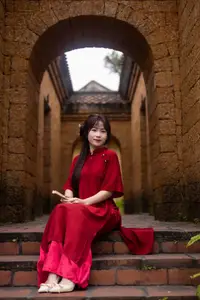 Discover the Timeless Elegance of a Vietnamese Woman in Red Ao Dai at Ancient Architecture.-0