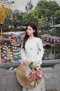 Elegant Vietnamese Beauty in White Ao Dai Serene Portrait with Pink Lilies on Ancient Stone Steps-5