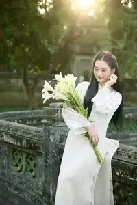 Graceful Vietnamese Woman in Ao Dai Amidst Ancient Architecture-1
