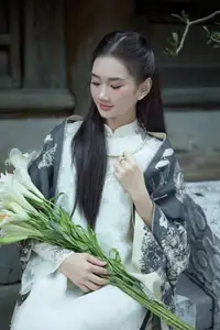 Graceful Vietnamese Woman in Ao Dai Amidst Ancient Architecture-3