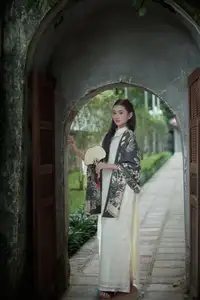 Graceful Vietnamese Woman in Ao Dai Amidst Ancient Architecture-4