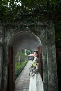 Graceful Vietnamese Woman in Ao Dai Amidst Ancient Architecture-9