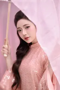 Discover Asian Beauty: Elegant Girl in Dreamy Pink Ao Dai Portrait-0