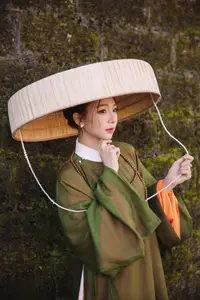 Timeless Vietnamese Charm: Elegant Girl in Traditional Attire and Nón Quai Thao-10