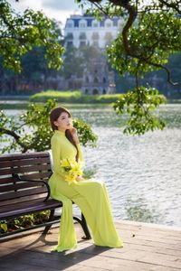 Serene Vietnamese Beauty: Woman in Ao Dai by the Lake-19