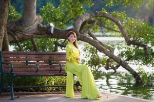 Serene Vietnamese Beauty: Woman in Ao Dai by the Lake-10