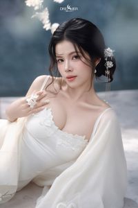 Discover Ethereal Grace: An Asian Beauty in Pure White Amidst Delicate White Blossoms-4