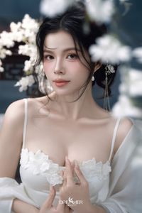 Discover Ethereal Grace: An Asian Beauty in Pure White Amidst Delicate White Blossoms-5