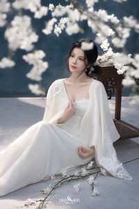 Discover Ethereal Grace: An Asian Beauty in Pure White Amidst Delicate White Blossoms-9