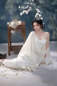 Discover Ethereal Grace: An Asian Beauty in Pure White Amidst Delicate White Blossoms-1