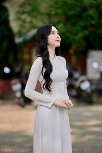 Captivating White Ao Dai: Elegant Vietnamese Girl in a Serene Moment, Timeless Beauty. Image ID: 1000019816.-4