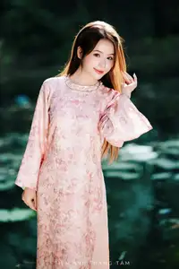 Vietnamese Charm: Elegant Beauty in Pink Traditional Attire-5
