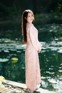 Vietnamese Charm: Elegant Beauty in Pink Traditional Attire-10
