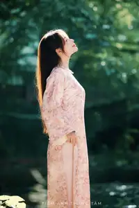 Vietnamese Charm: Elegant Beauty in Pink Traditional Attire-4