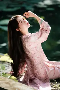 Vietnamese Charm: Elegant Beauty in Pink Traditional Attire-11