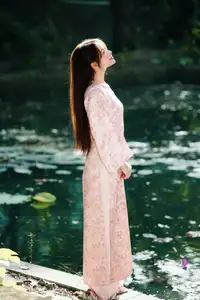 Vietnamese Charm: Elegant Beauty in Pink Traditional Attire-9